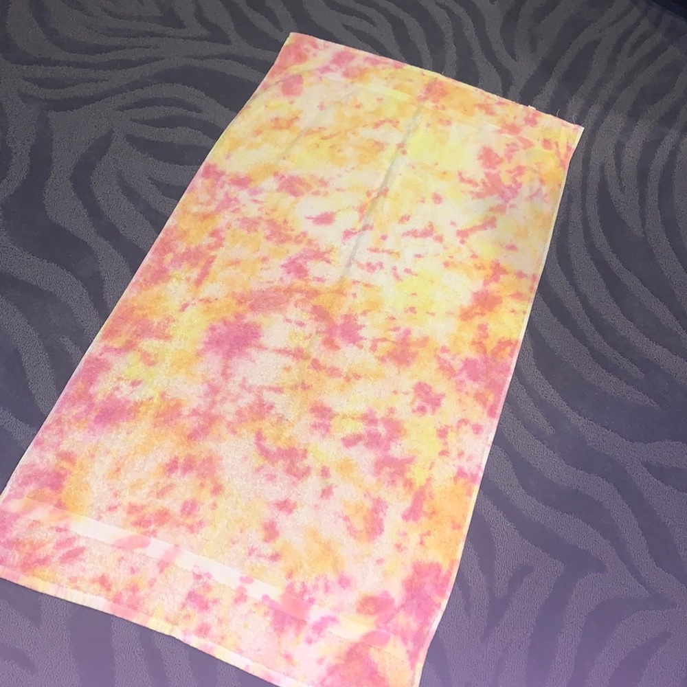 pink and yellow tie dye towel